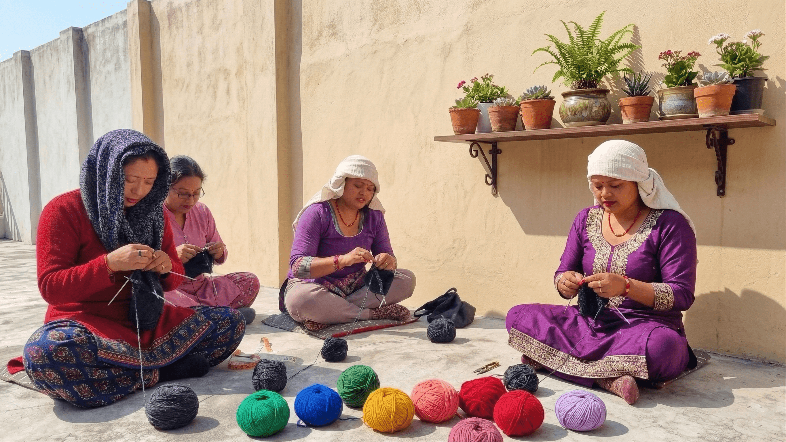 Vertical portrait of a smiling artisan holding a finished product